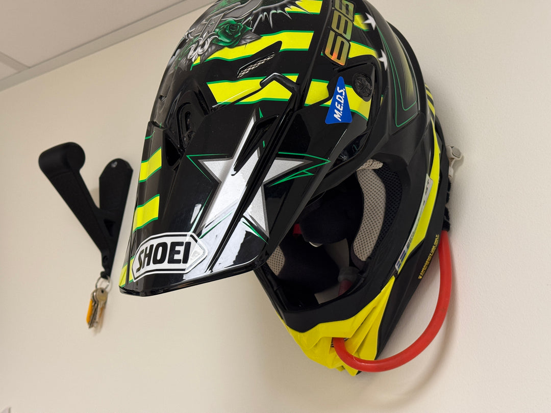 Wall mounted motocross helmet holder